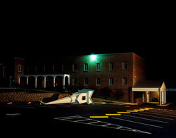 Photograph by RaMell Ross of a church spire on the ground in a parking lot at night.