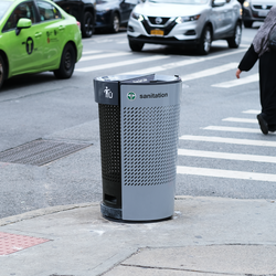 Better Bin, a new design for trash cans in New York, on a street corner.