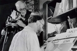black-and-white image of late filmmaker Robert Flaherty filming late RISD professor John Howard Benson