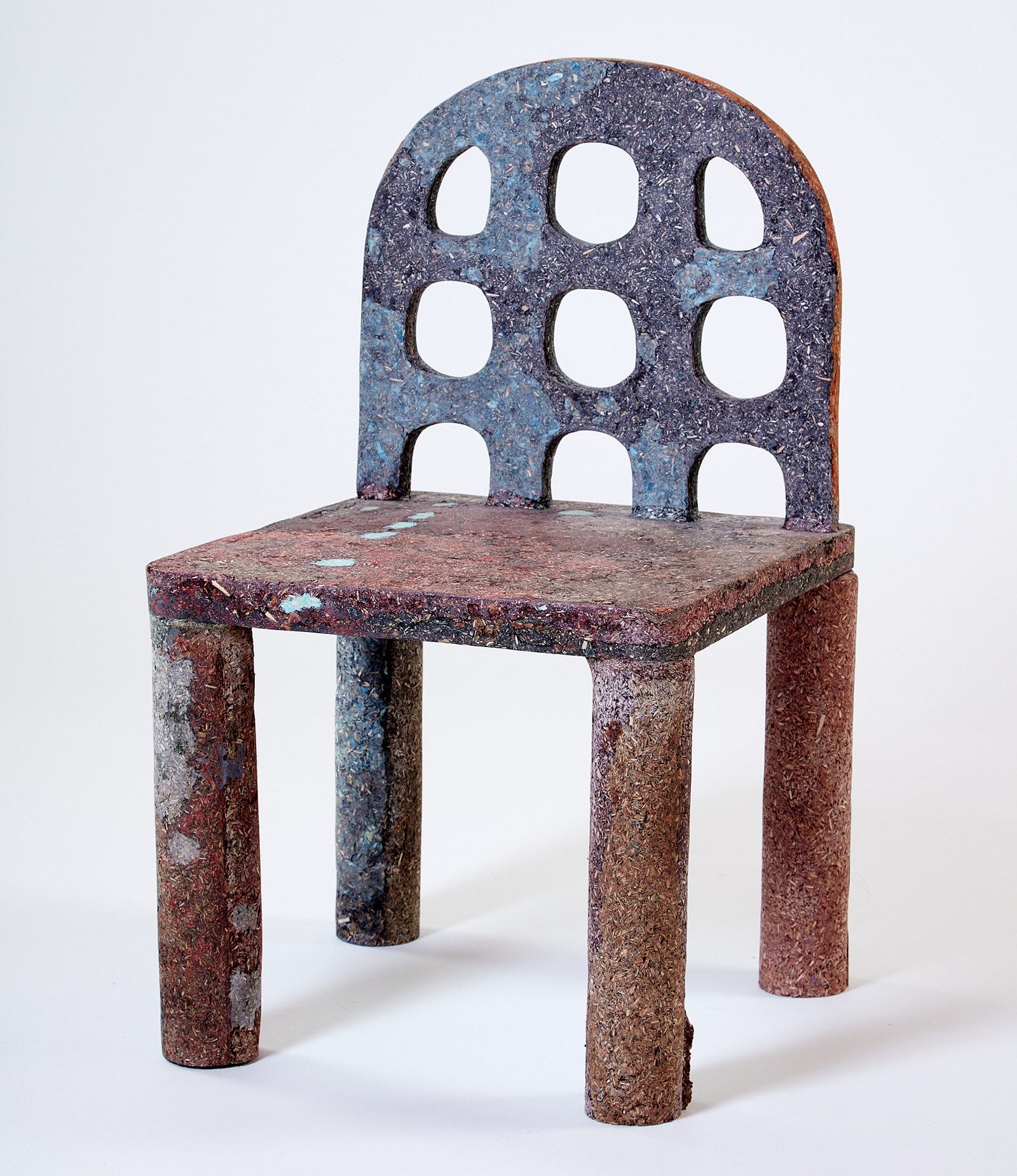 an upright chair made of dust particles