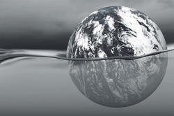a silver globe floating in water
