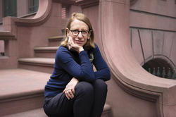 Roz Chast sitting on the steps of her building in NYC