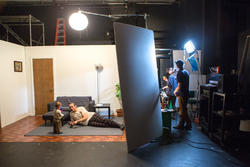 Film Animation Video students working in studio as actors keep their places on a sound set