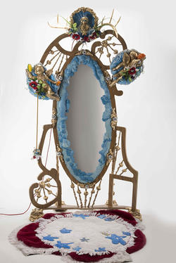 An ornately decorated mirror by Furniture Design alum Maxwell McInnis