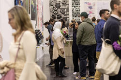 crowds of visitors check out work at Grad Show 2023