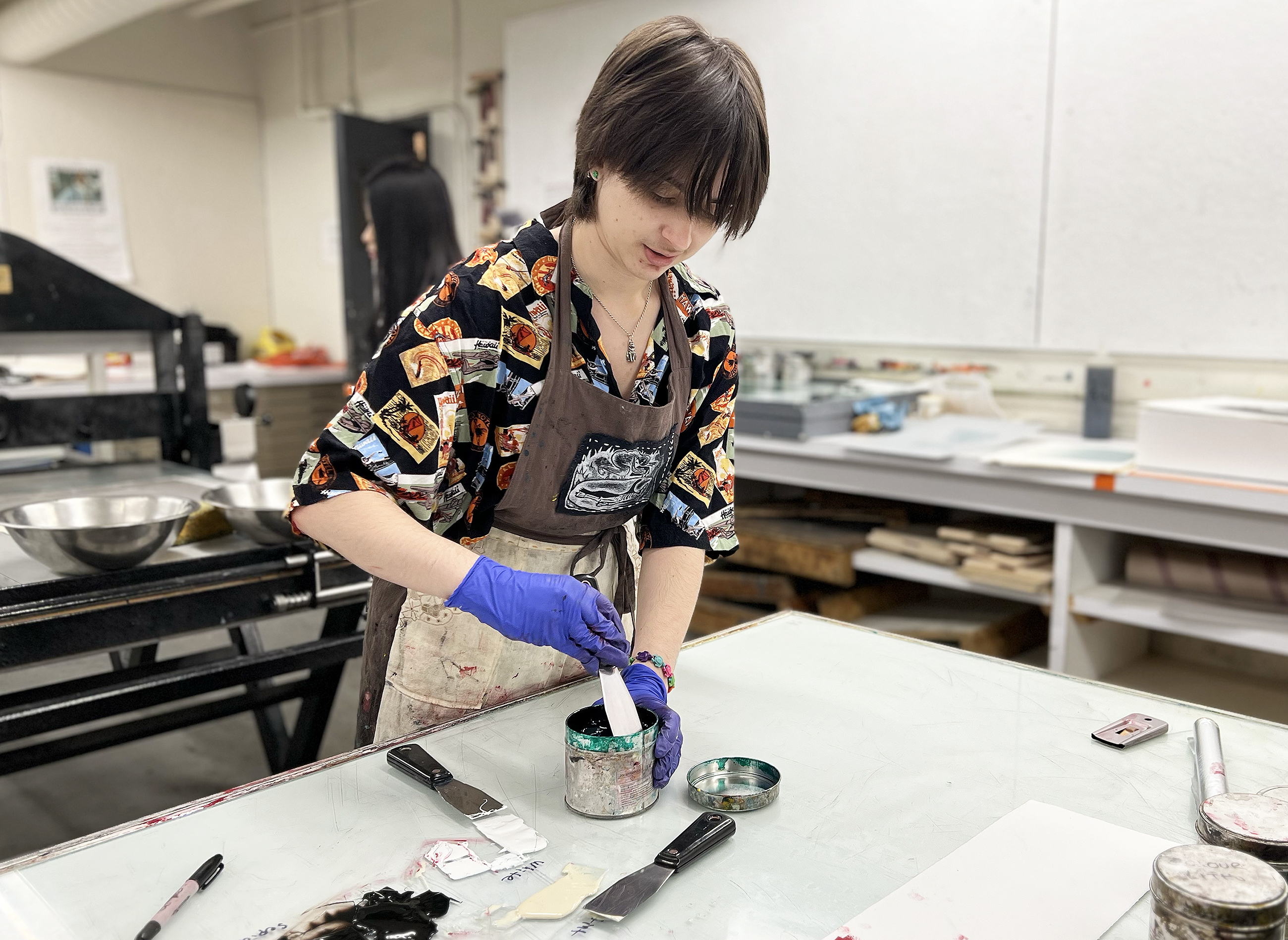 a student mixes inks