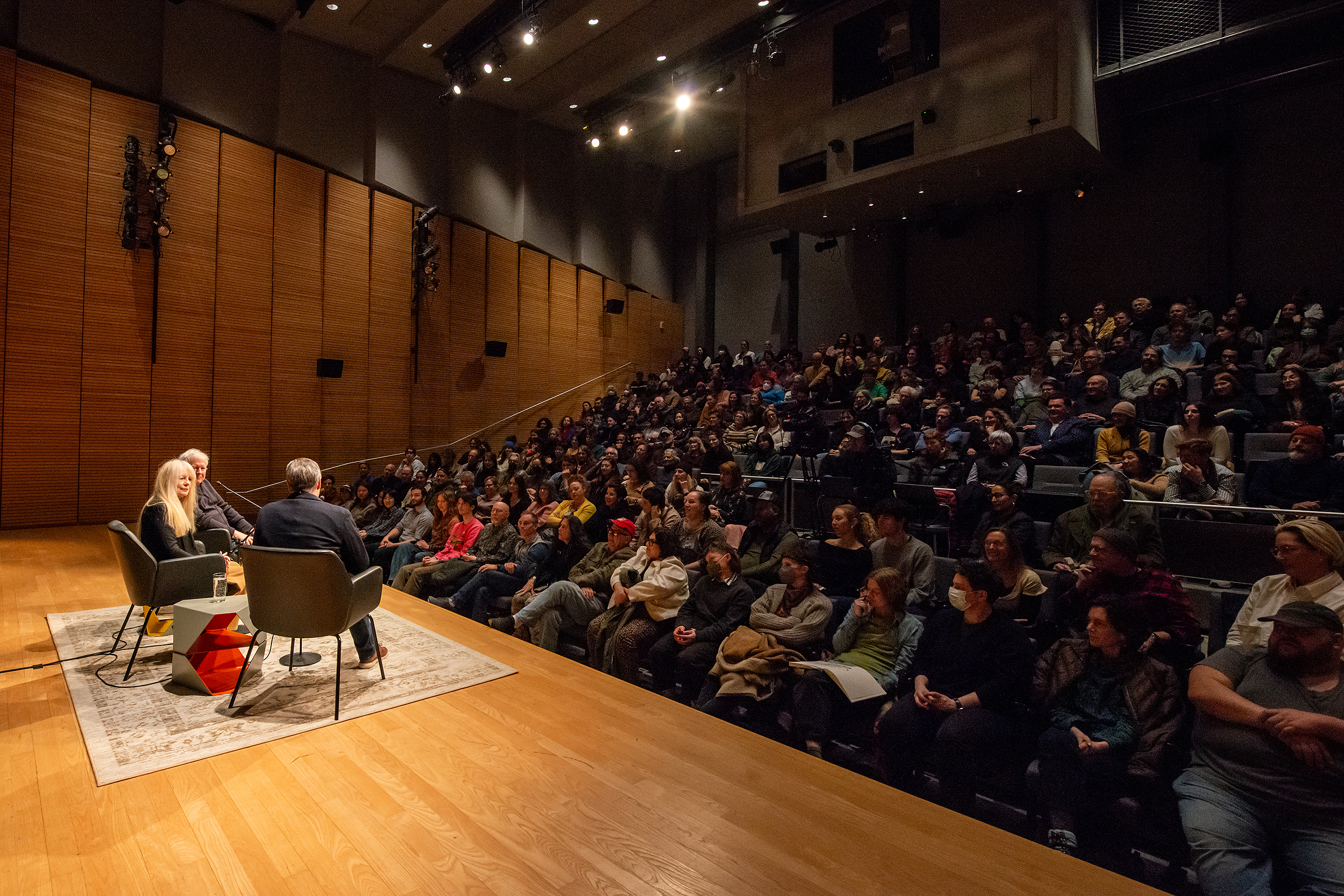 a view of the stage and packed house at the Martinos Auditorium