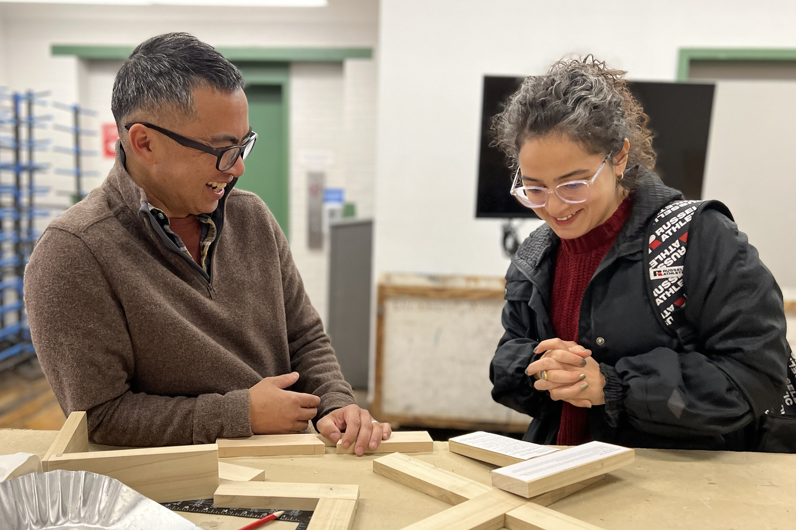 faculty member Tom Weis in the shop with a student