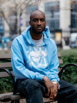Virgil Abloh sitting on an outdoor park bench